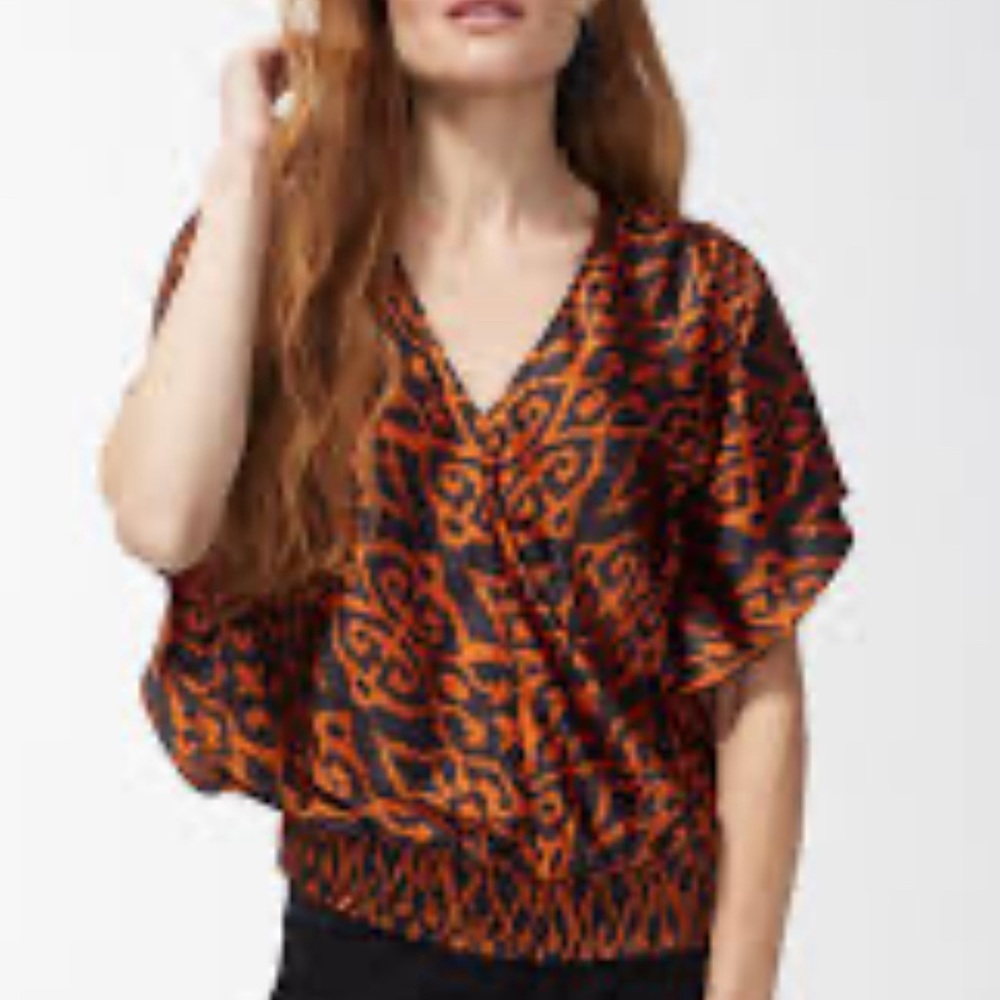 Silky Orange ikat top with great styling.